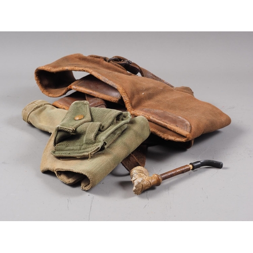 287 - A Jacob meerschaum pipe, a canvas pistol holster, and a canvas and leather rifle bag