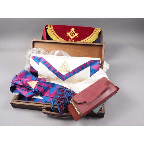 289 - Two cased Masonic aprons, a Masonic jewel, and a cased set of Masonic documents