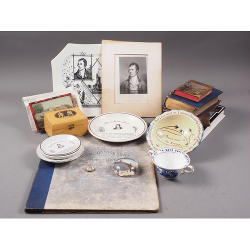 291 - An assortment of collectables relating to Robert Burns, including a Mauchline ware box, books, ceram... 