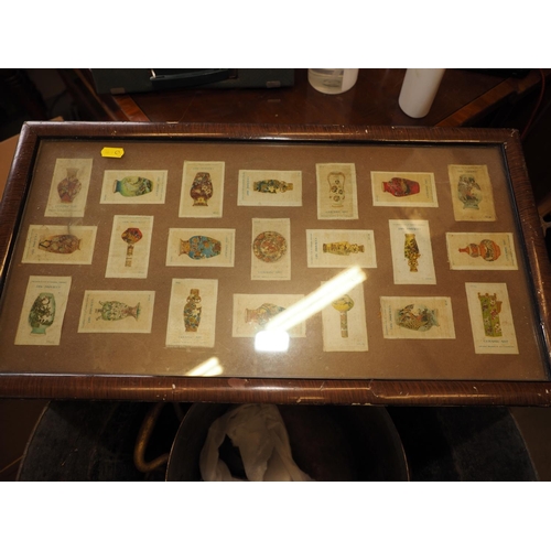 297 - An early 20th century grained as walnut two-handled tray top, inset silk cigarette cards 