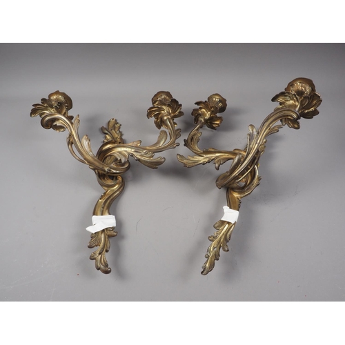 325 - A pair of 19th century gilt brass Rococo scroll two-light wall brackets, 16 1/2