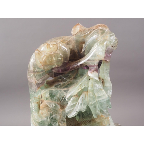 326 - A Chinese carved fluorite two-handled vase with phoenix cover, 20