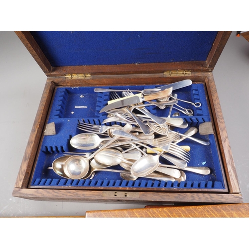 349 - An assortment of silver plated cutlery, in an oak canteen, an Elkington & Co part fish knife and for... 