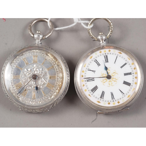 411 - A silver cased fob watch with engraved case and silver dial with Roman numerals and a similar fob wa... 