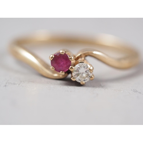 417 - A 9ct gold, diamond and sapphire dress ring, size J, 1.9g, a 9ct gold, diamond and ruby crossover ri... 