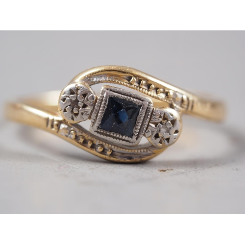 418 - An 18ct gold, sapphire and diamond crossover ring, size J/K, 1.8g, and a 22ct gold wedding band, siz... 