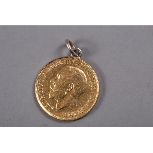 425 - A gold sovereign, dated 1911 (hard mounted)