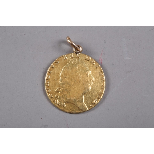 428 - A gold guinea, dated 1793 (hard mounted)