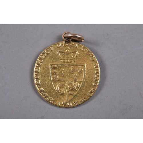 428 - A gold guinea, dated 1793 (hard mounted)