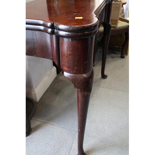 546 - An early George III mahogany fold-over top card table with counter wells and single gate, on shaped ... 