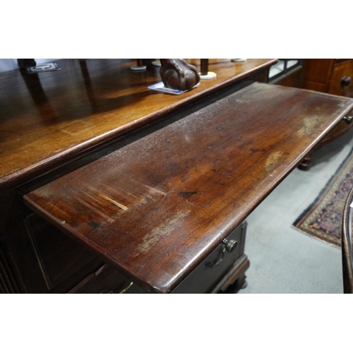 602 - A bachelor's Georgian mahogany chest with fluted columns, fitted slide over three long graduated dra... 