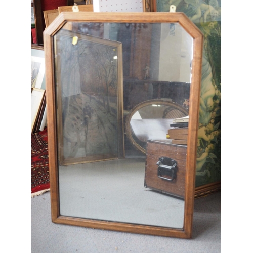 627 - A 1930s oak rectangular framed wall mirror with cut corners, plate 29