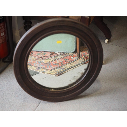 628 - An oak framed circular wall mirror, 18 1/2