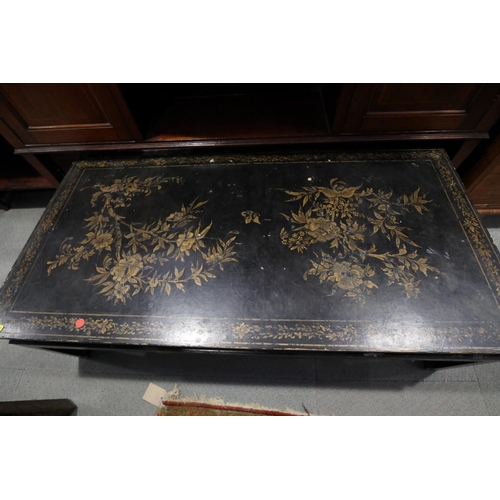 673 - A Chinese black and gold lacquered low occasional table, on scroll end supports, 49