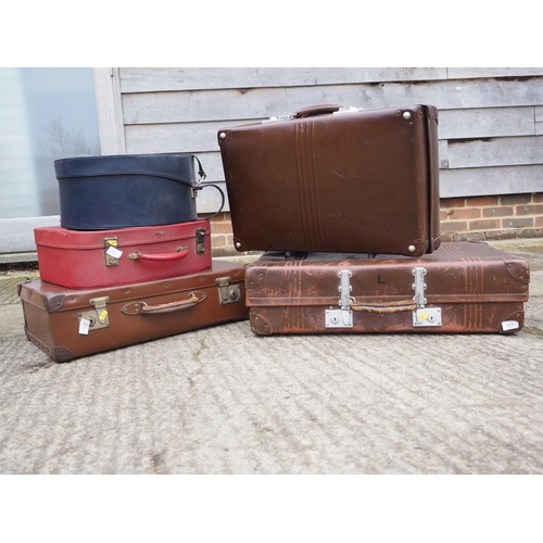 751 - A practically unused leather vintage suitcase and a number of other suitcases, various