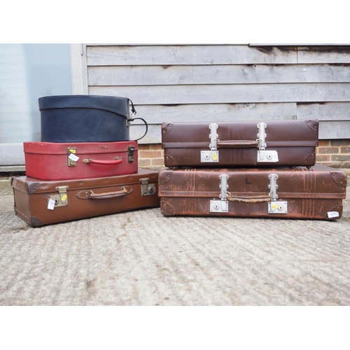 751 - A practically unused leather vintage suitcase and a number of other suitcases, various