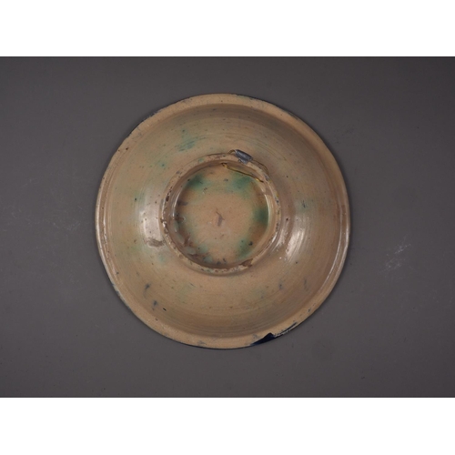 9 - A 19th century Moorish shallow bowl with green, yellow and blue decoration, 14 1/2