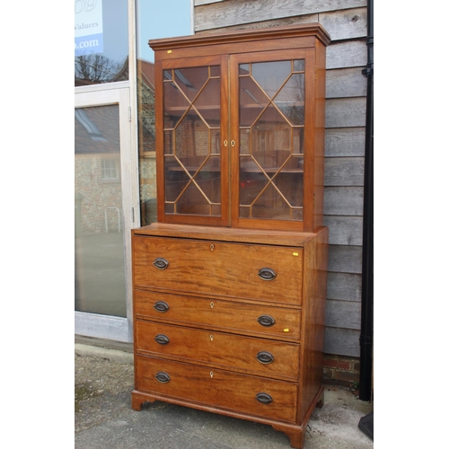 580 - A 19th century walnut and burr yew inlaid secretaire bookcase, the upper section enclosed two astrag... 