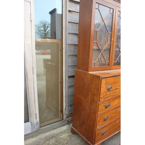 580 - A 19th century walnut and burr yew inlaid secretaire bookcase, the upper section enclosed two astrag... 