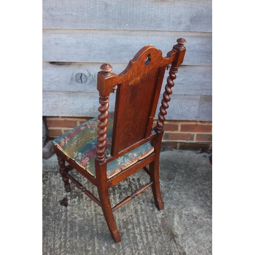 606 - A late 19th century carved oak side chair of 17th century design with padded seat and back, on barle... 