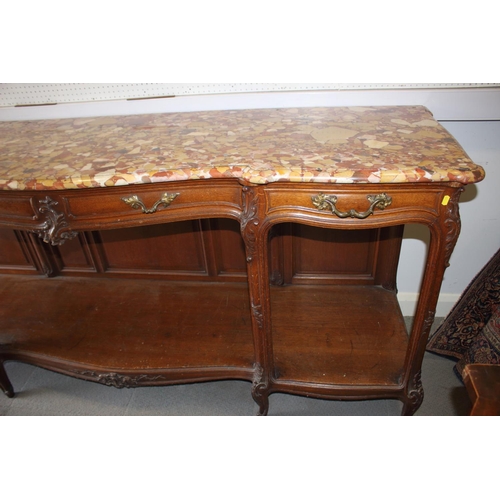 608 - A 19th century French carved oak buffet with serpentine marble top over three drawers and undertier,... 