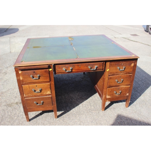 641 - A partners early 20th century walnut double pedestal desk with green leather top (for restoration), ... 