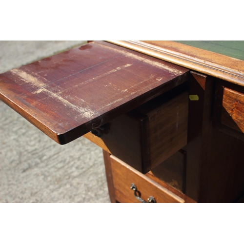 641 - A partners early 20th century walnut double pedestal desk with green leather top (for restoration), ... 