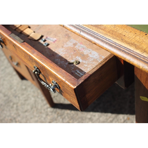 641 - A partners early 20th century walnut double pedestal desk with green leather top (for restoration), ... 