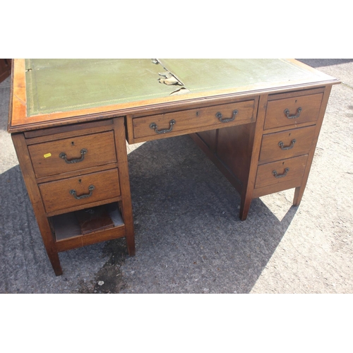 641 - A partners early 20th century walnut double pedestal desk with green leather top (for restoration), ... 