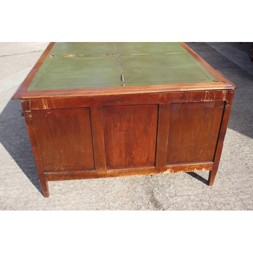 641 - A partners early 20th century walnut double pedestal desk with green leather top (for restoration), ... 