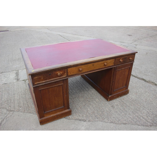 642 - A partners early 20th century mahogany double pedestal desk with red leatherette top, fitted two dra... 