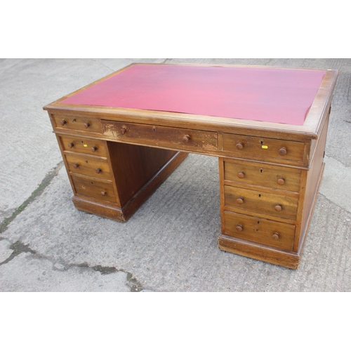 642 - A partners early 20th century mahogany double pedestal desk with red leatherette top, fitted two dra... 