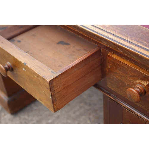 642 - A partners early 20th century mahogany double pedestal desk with red leatherette top, fitted two dra... 