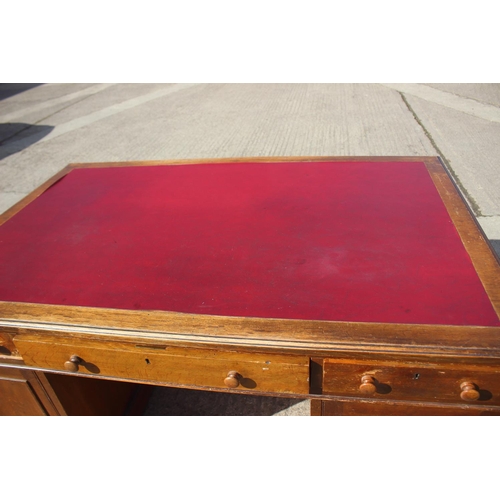 642 - A partners early 20th century mahogany double pedestal desk with red leatherette top, fitted two dra... 