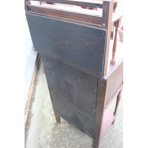 657 - A side cabinet with raised mirror back over two doors and undertier, on turned supports 22