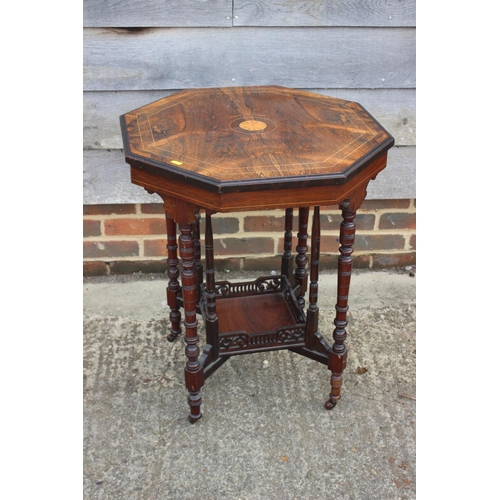 660 - An Edwardian rosewood and inlaid octagonal two-tier occasional table, on turned and castored support... 