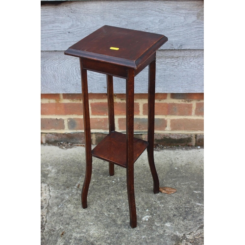 661 - An early 20th century carved mahogany jardiniere stand with floral panels, 11