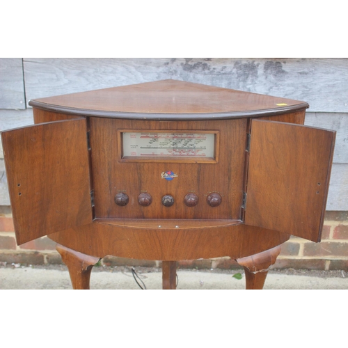 662 - An early 20th century Marconi valve radio, in fitted walnut bowfront corner cabinet, on cabriole sup... 