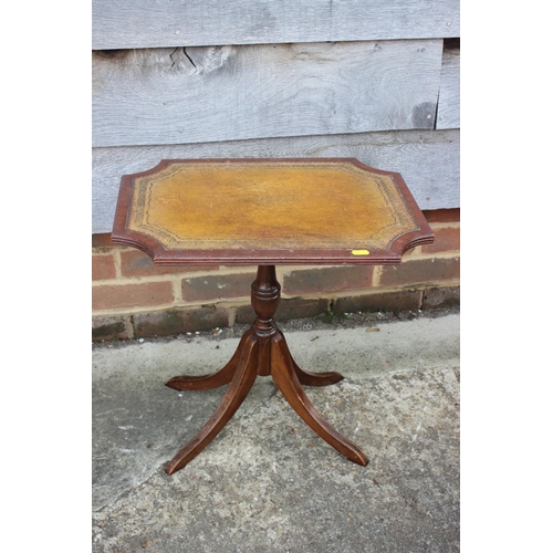 664 - Two mahogany shape top occasional tables with tooled lined tops, on turned column and quadruple spla... 