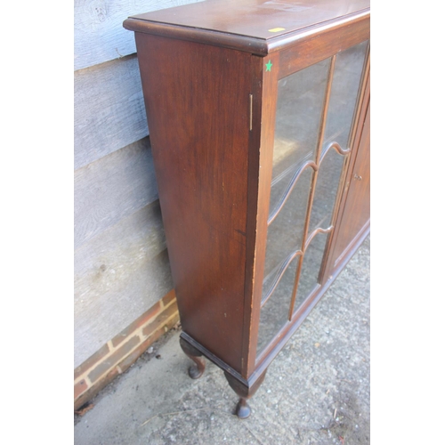 695 - An Edwardian mahogany display cabinet enclosed panel door, flanked lattice glazed doors, on cabriole... 