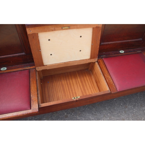 700 - A set of three mahogany four-box seat pews, by C Mellier & Co. 76