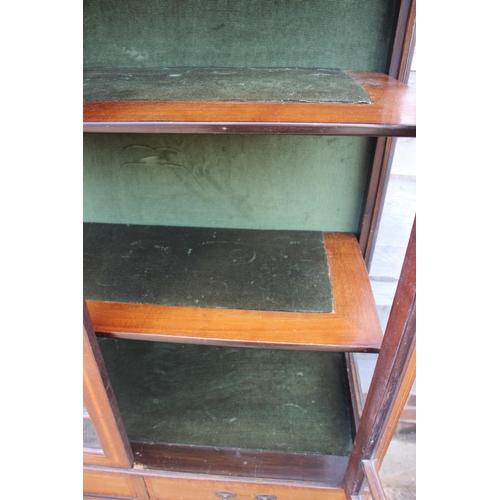 705 - An Edwardian walnut banded and line inlaid display cabinet with astragal glazed doors enclosed two s... 