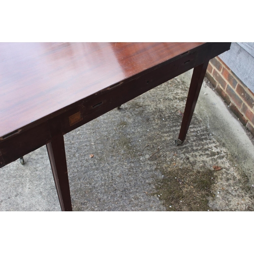 706 - A mahogany 'D' end table, on square taper supports, 47