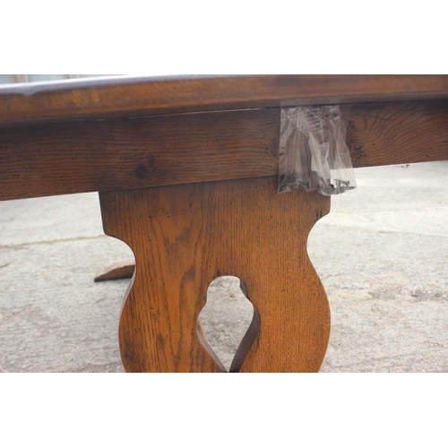 716 - An oak dining table with planked top, on square supports, 84