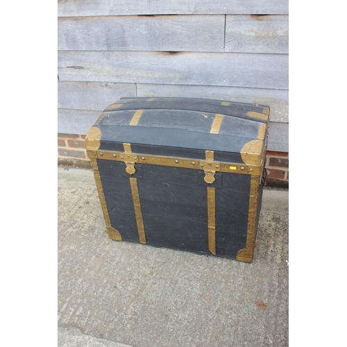 754 - A brass bound dome top trunk with wrought iron carry handles, 30