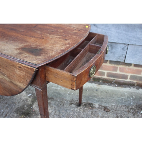 587 - A 19th century mahogany oval Pembroke table, fitted one drawer with brass ring handle, on square tap... 