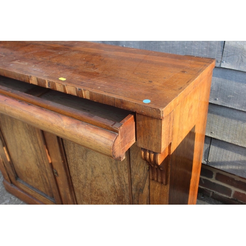 588 - A 19th century rosewood chiffonier, fitted frieze drawer over cupboard enclosed panelled doors, on b... 