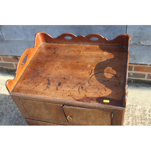 590 - A 19th century mahogany tray top washstand enclosed two doors over pull-out slide, 21 1/2