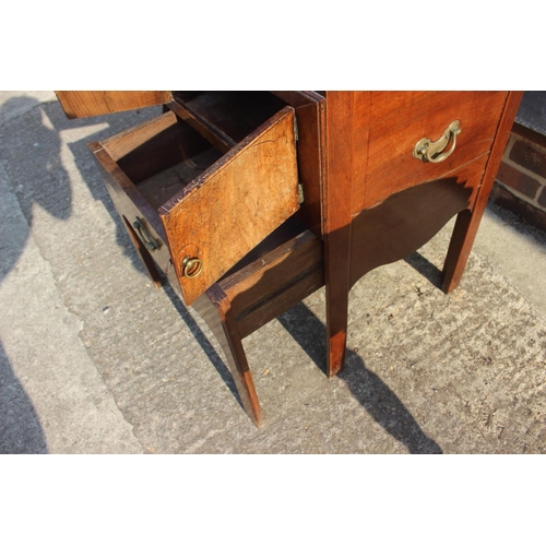 590 - A 19th century mahogany tray top washstand enclosed two doors over pull-out slide, 21 1/2