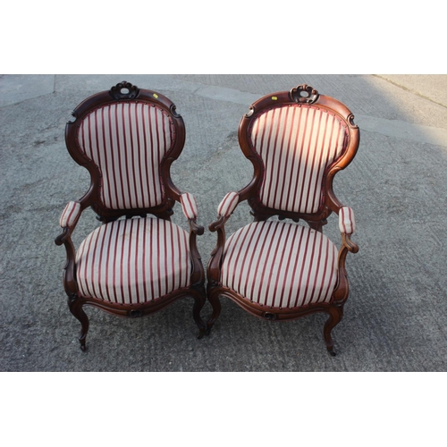 595 - A 19th century carved rosewood showframe three-seat settee with cameo back and stuffed over seat, up... 